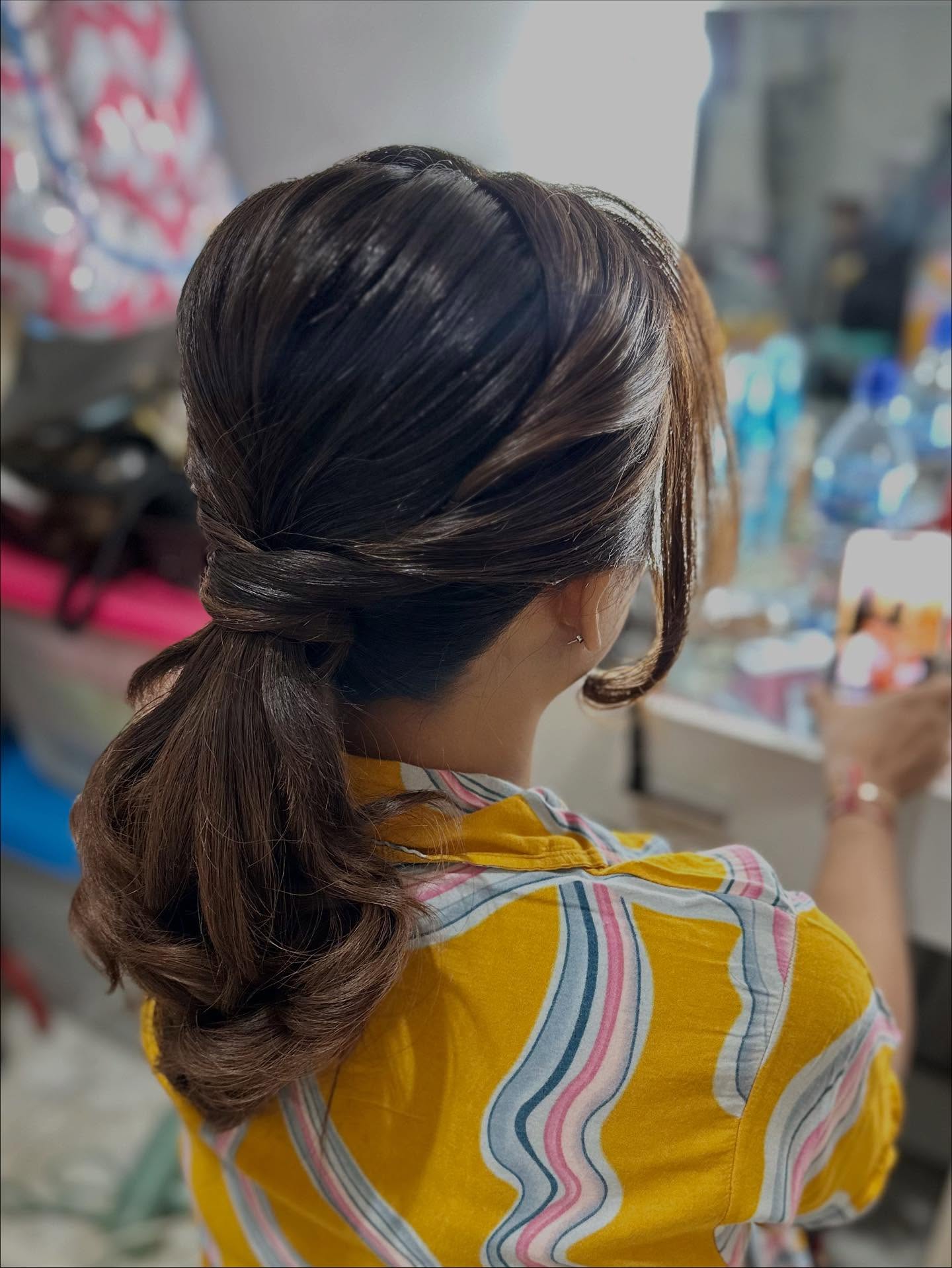 Chic Twisted Low Ponytail with Soft Waves