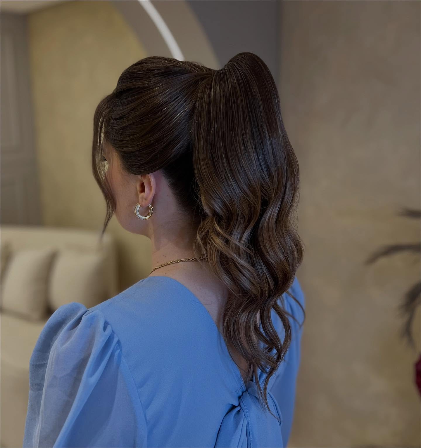 Sleek High Ponytail with Soft Waves