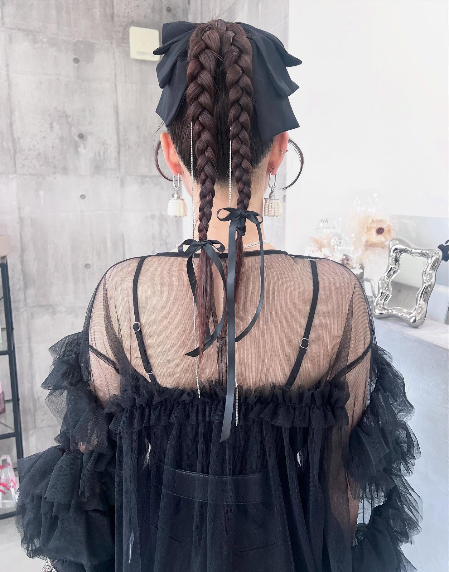 Chic Dual Braids with Playful Ribbon Accents