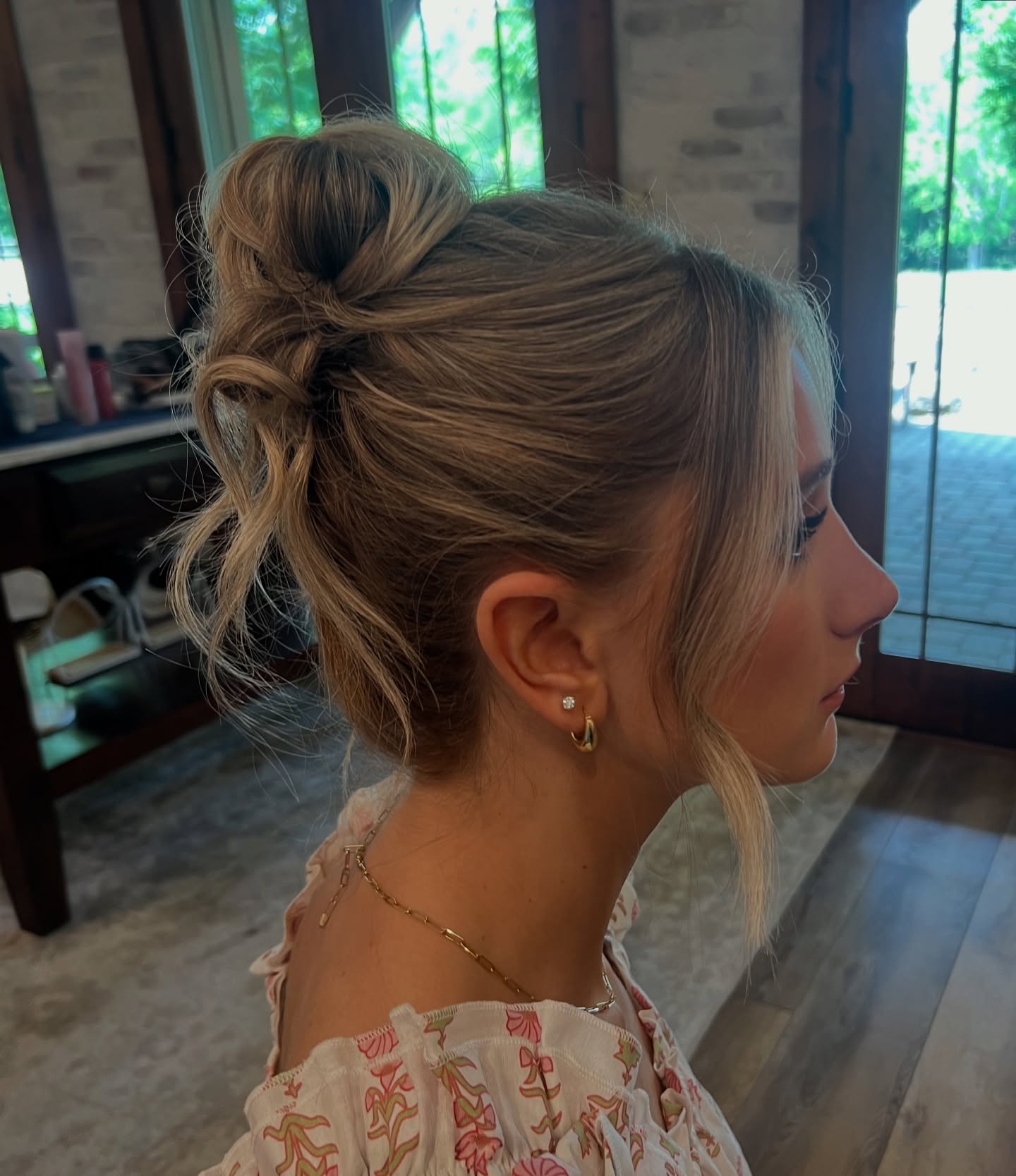 Effortlessly Chic Textured Bun with Face-Framing Strands