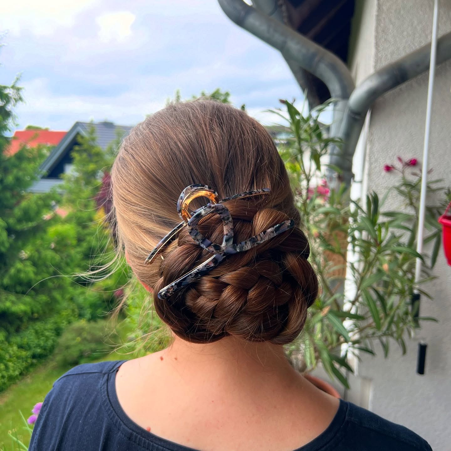Elegant Braided Low Bun with Decorative Hairpins
