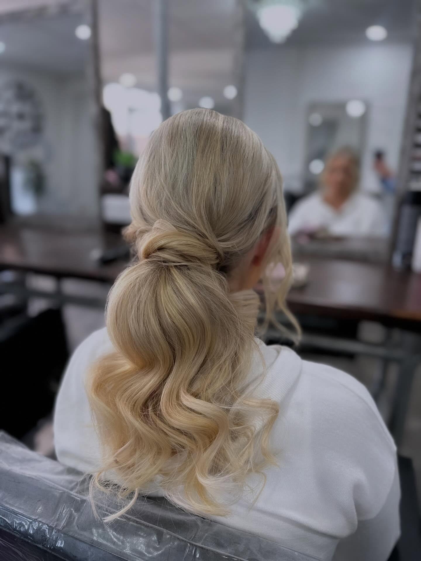 Elegant Soft Waves in a Low Ponytail