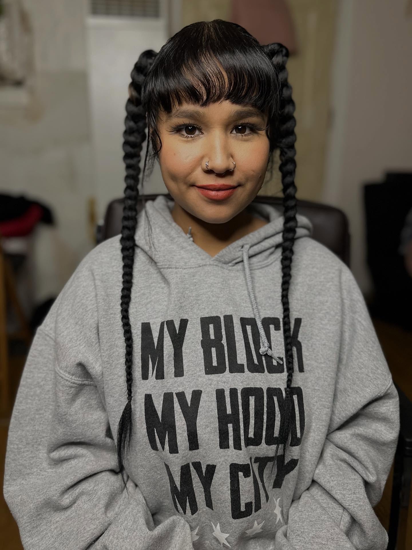 Playful Double Braids with Baby Bangs