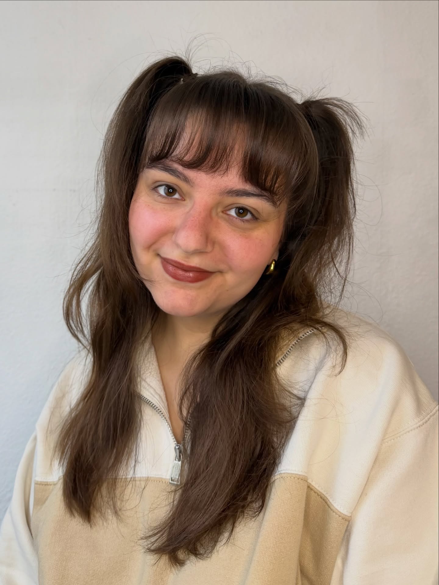 Playful Half-Up Ponytails with Soft Bangs
