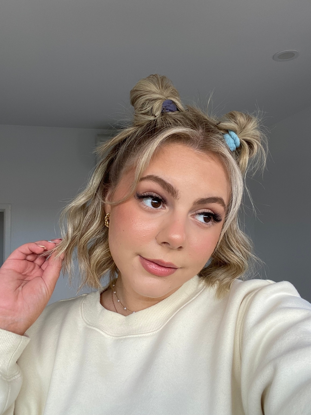 Playful Twisted Buns with Beachy Waves