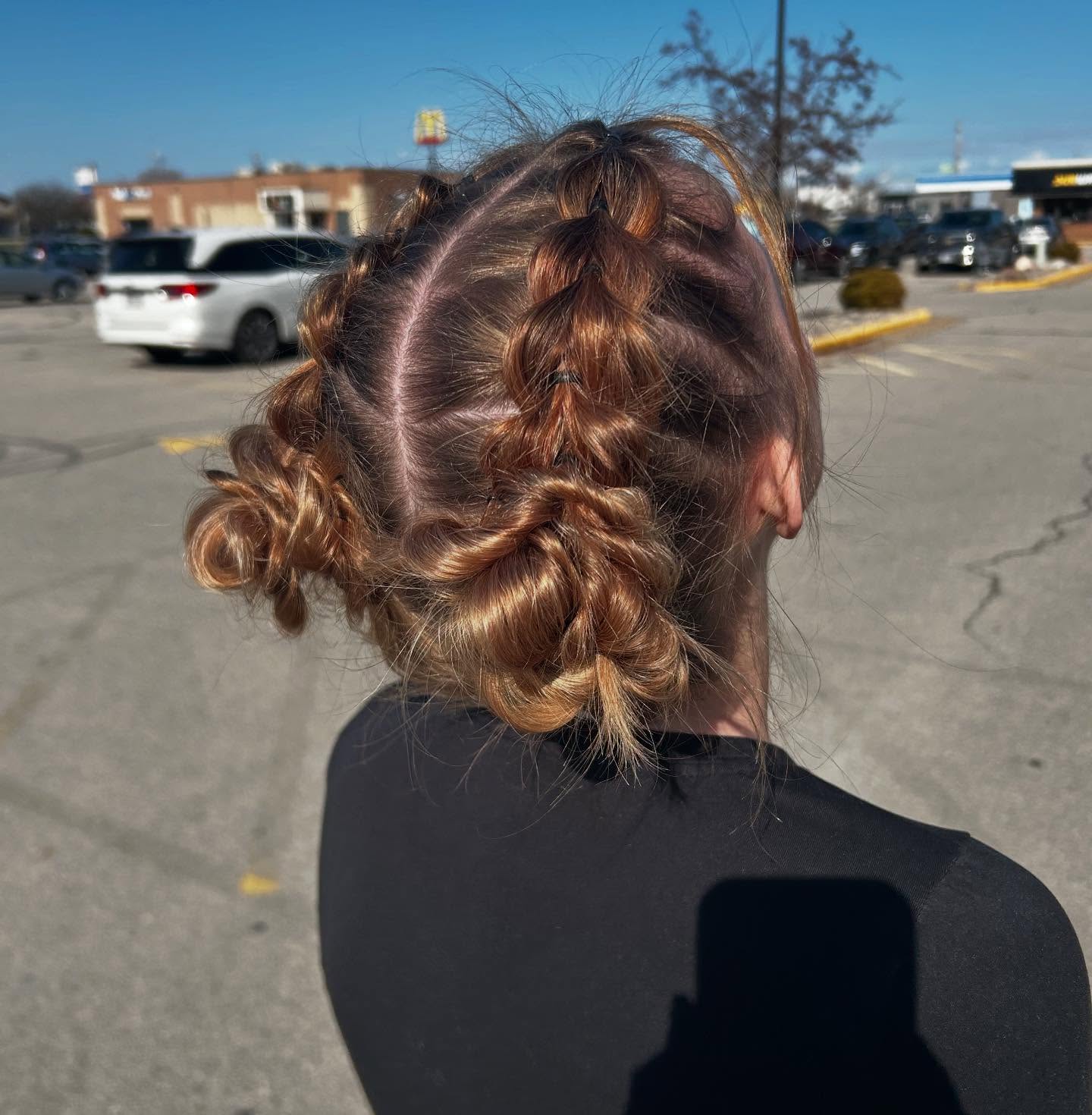 Whimsical Braided Updo with Spiraled Curls