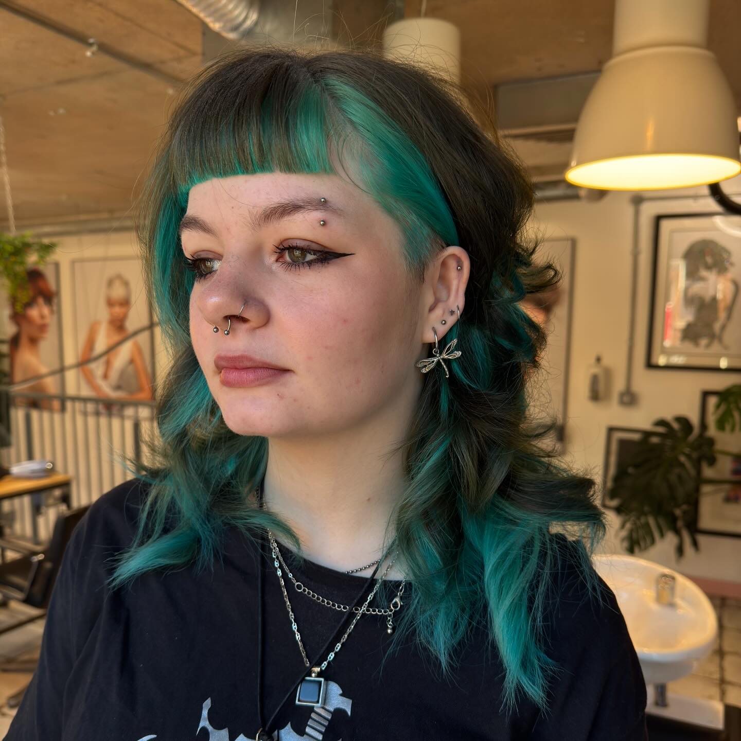 Playful Textured Cut with Vibrant Teal Highlights
