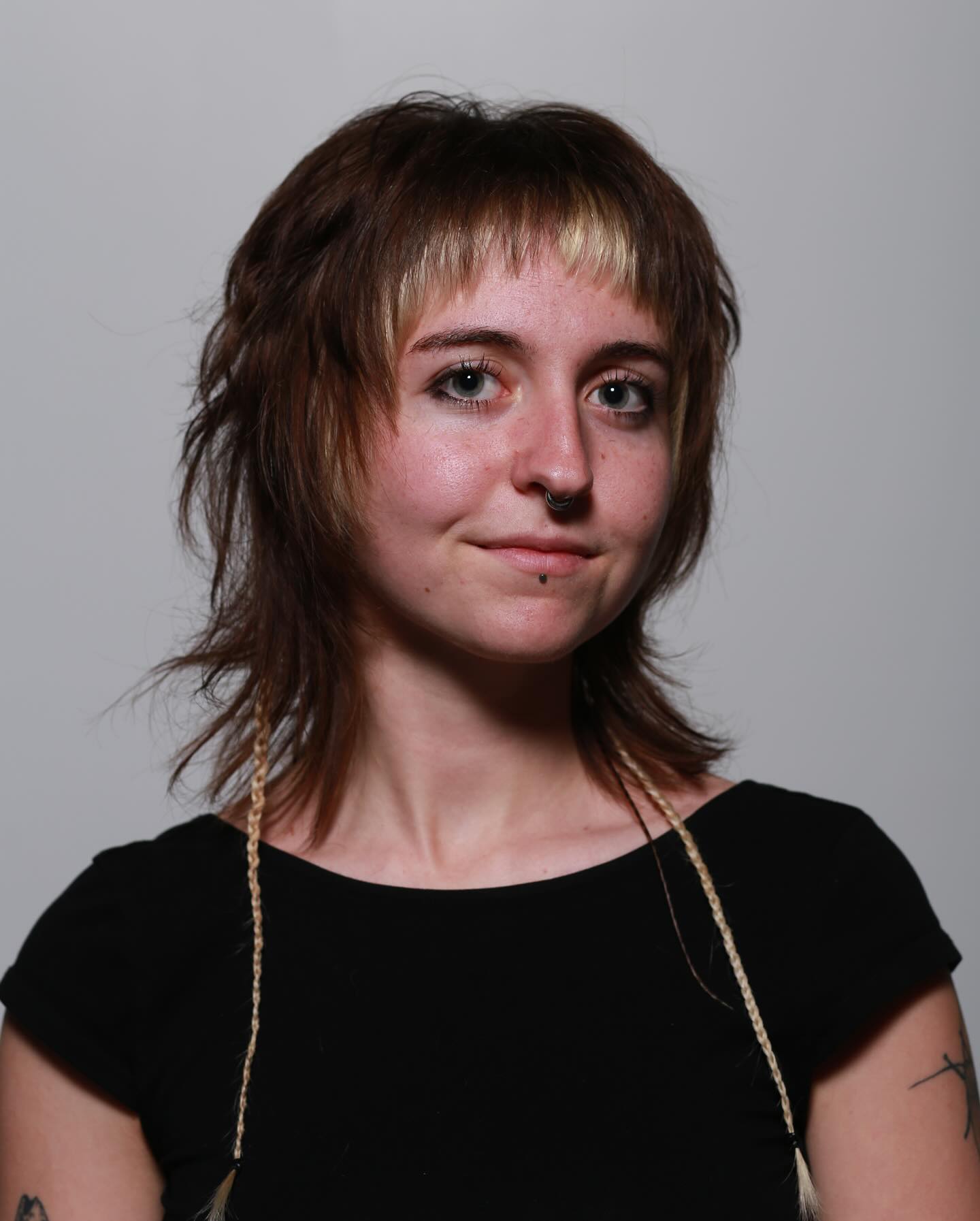 Trendy Textured Mullet with Subtle Blonde Highlights