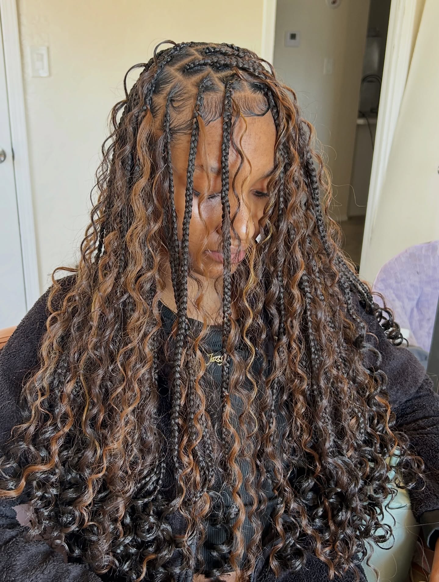 Chic Curly Braids with Intricate Cornrow Accents