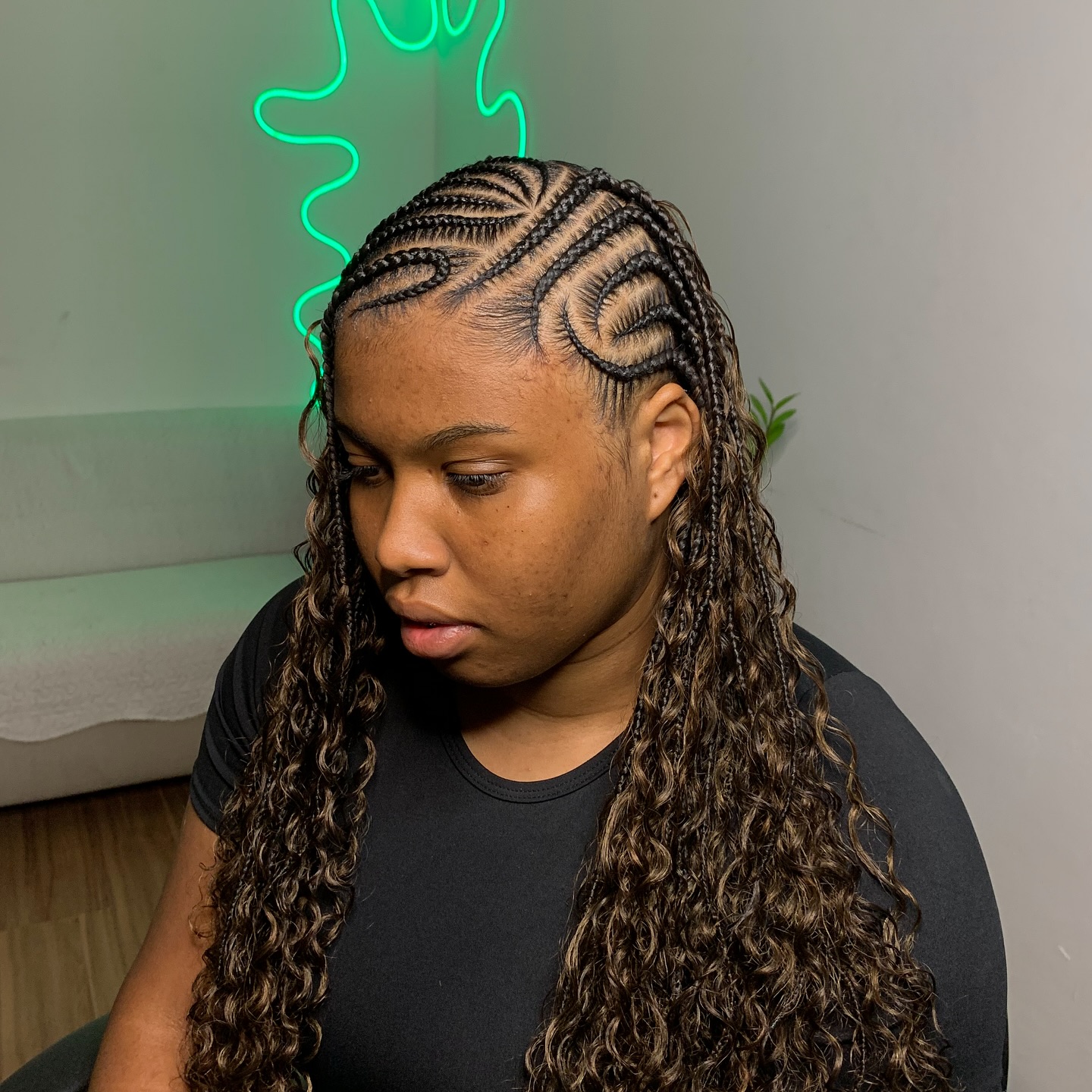 Intricate Cornrow Braids with Loose Curling Ends