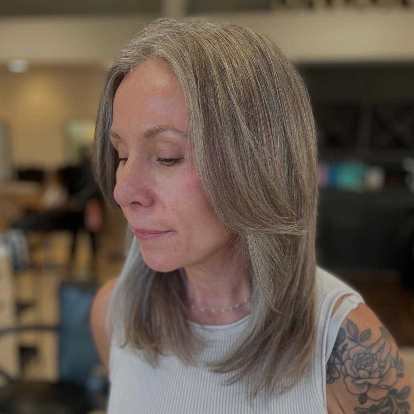 Sleek Layered Ash Gray with Subtle Blonde Highlights