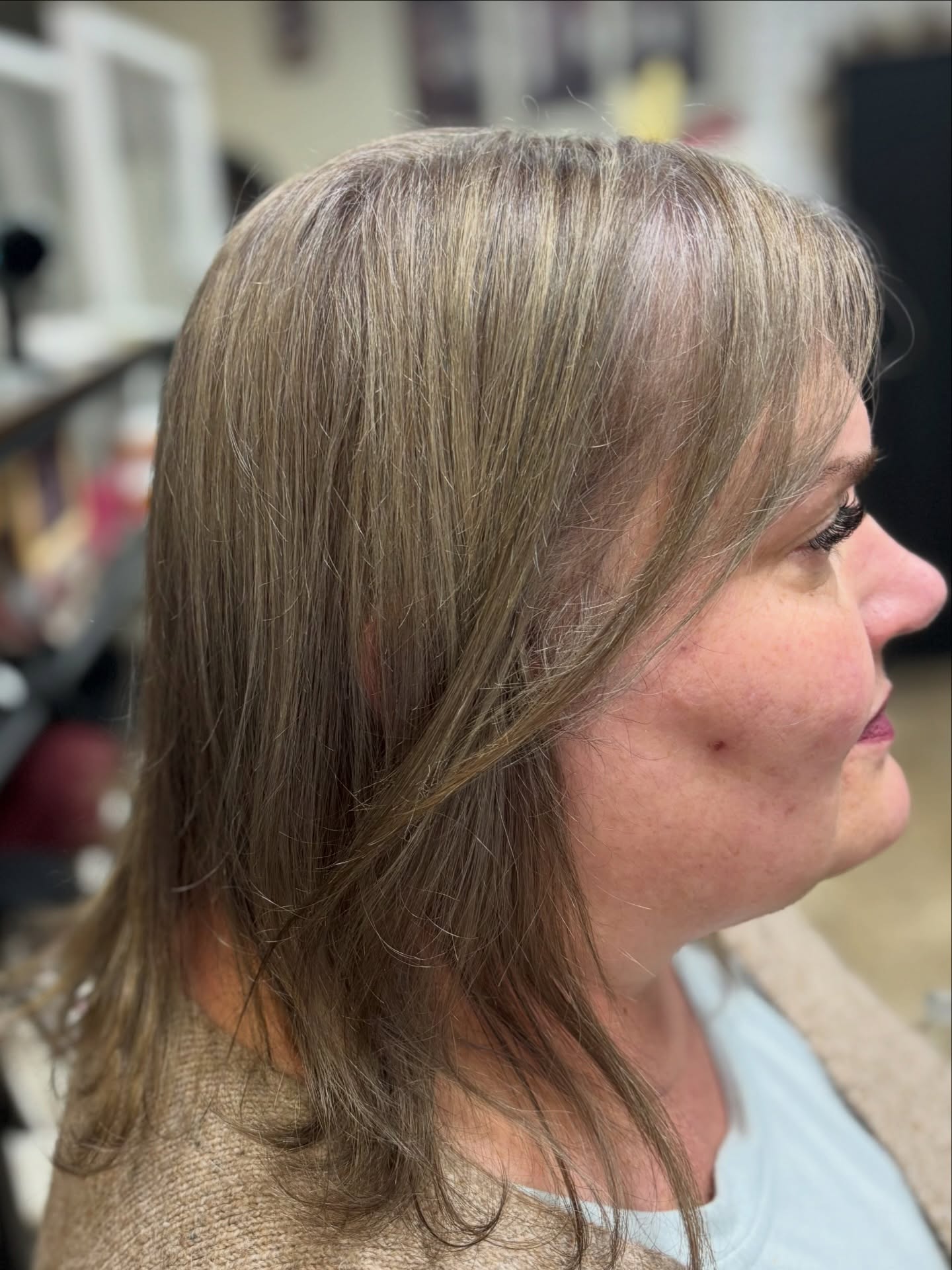 Soft Layered Gray and Blonde Blend with Subtle Movement
