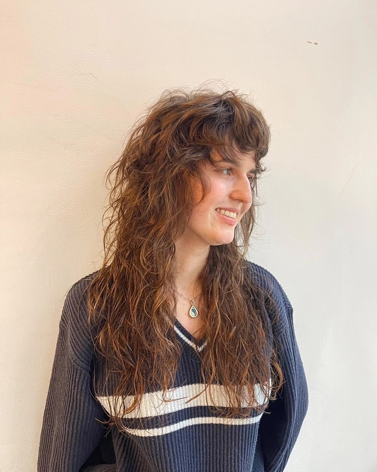 Modern Textured Wavy Cut with Face-Enhancing Bangs