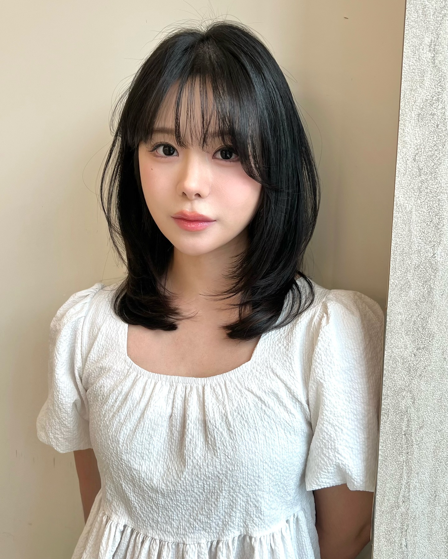 Stylish Medium-Length Cut with Whispy Bangs