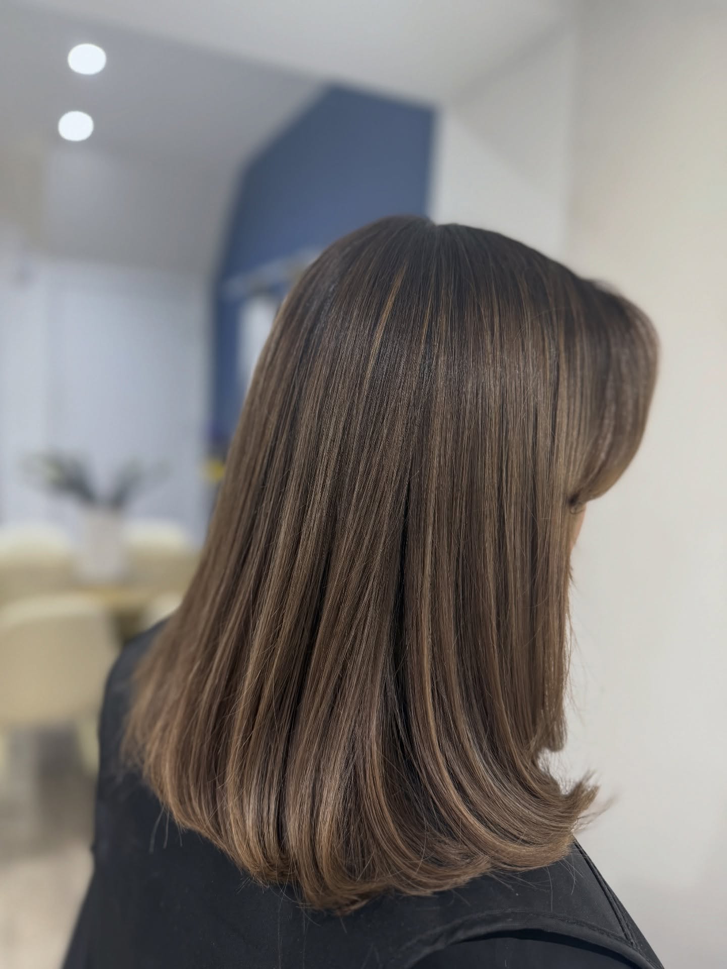 Glossy Brown Lob with Soft Face-Framing Layers