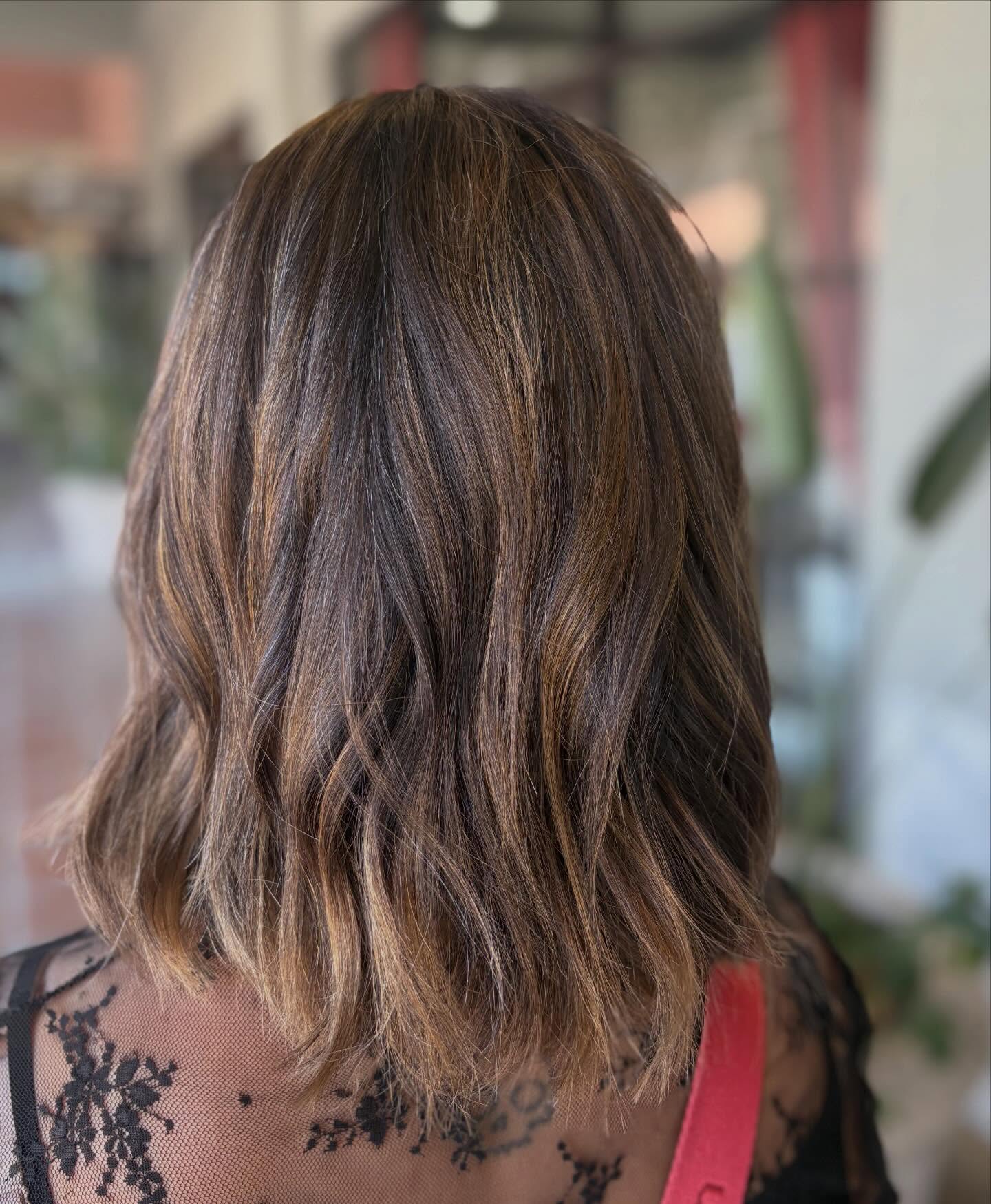 Textured Mid-Length Cowgirl Cut with Subtle Highlights