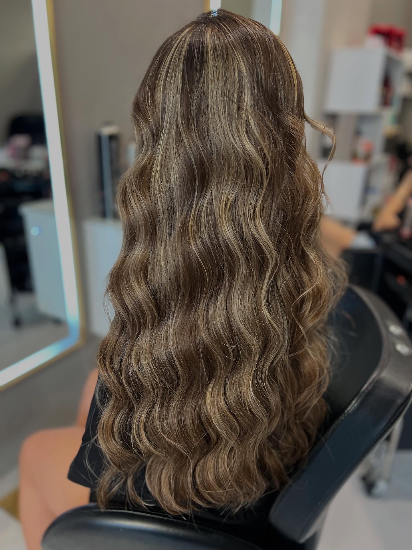 Beautifully Textured Brunette Waves with Subtle Blonde Highlights