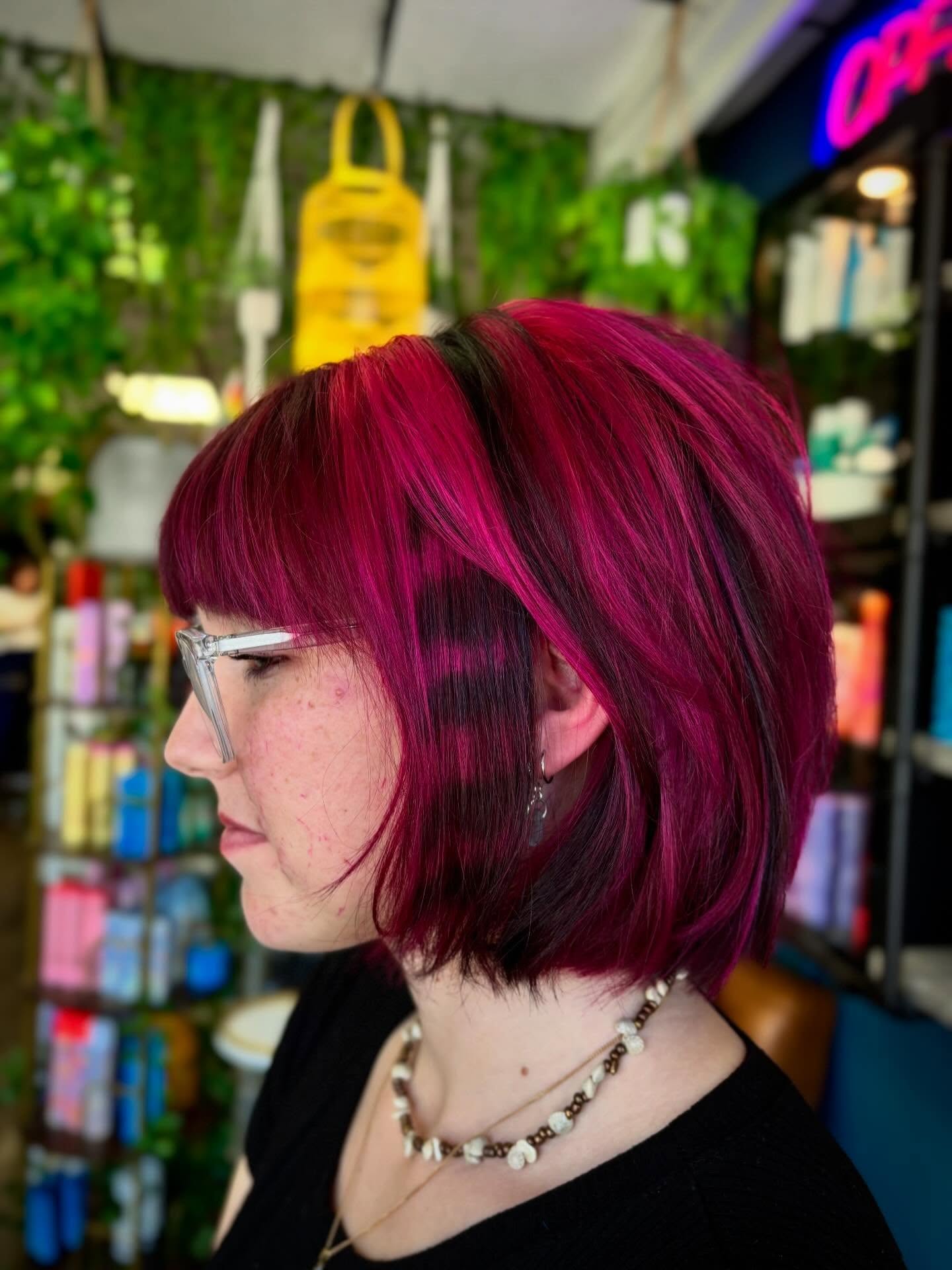 Bold Layered Bob with Pink and Black Highlights