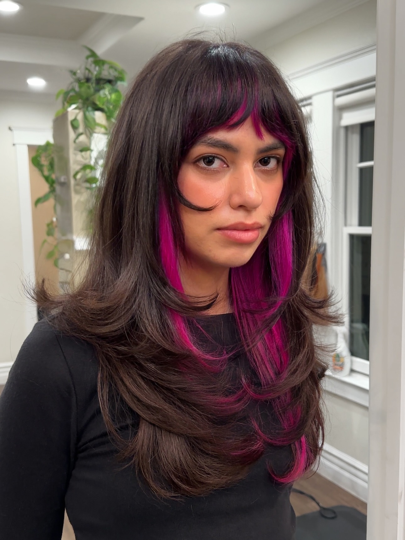 Chic Layered Cut with Bold Pink Highlights