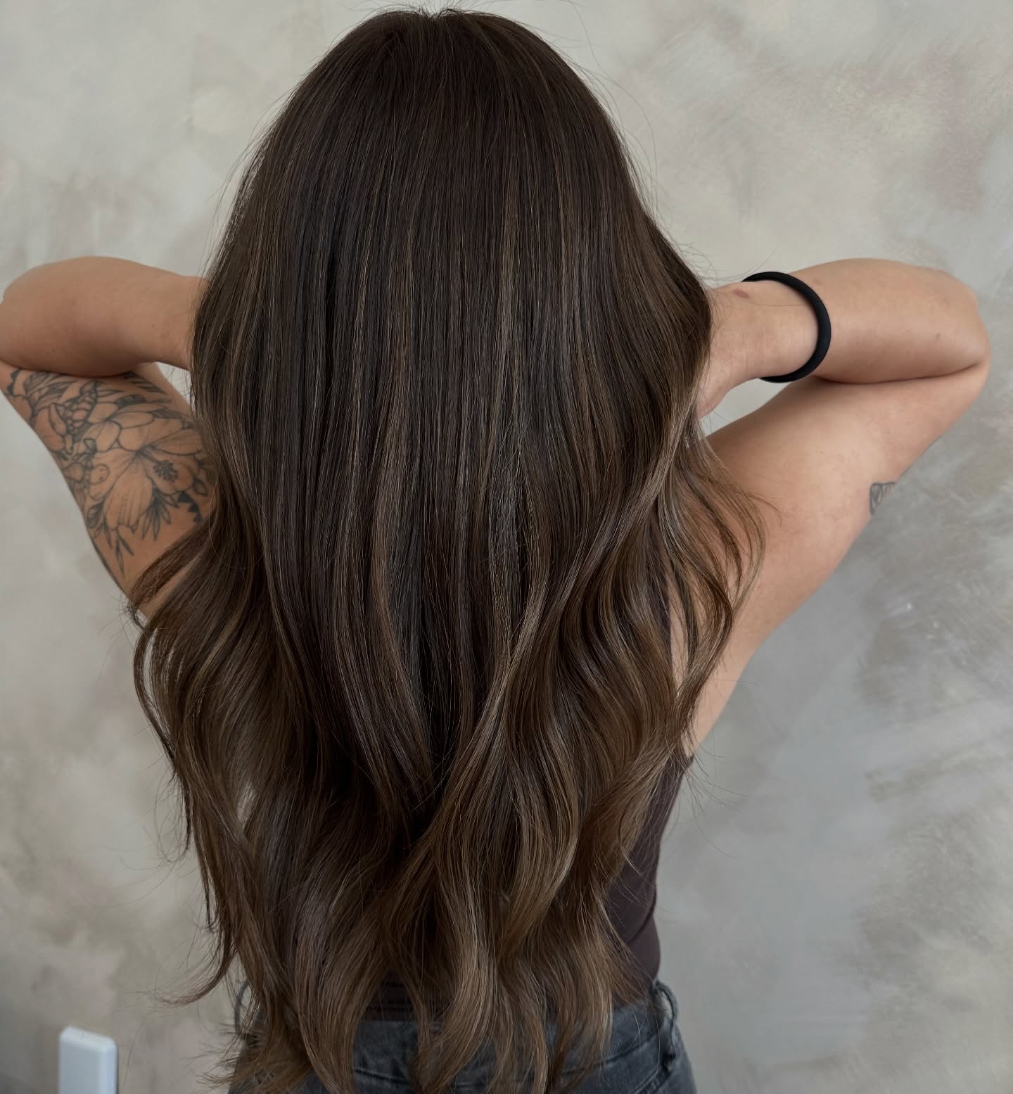 Long Brunette Waves with Subtle Blonde Highlights