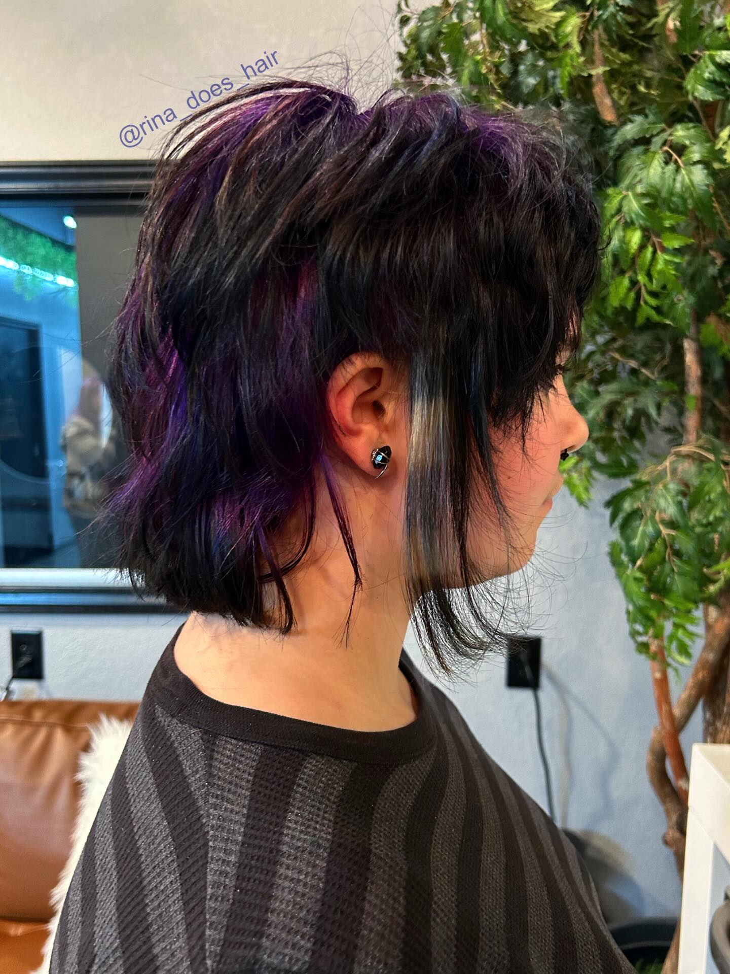 Playful Dark Layered Cut with Bold Purple Highlights