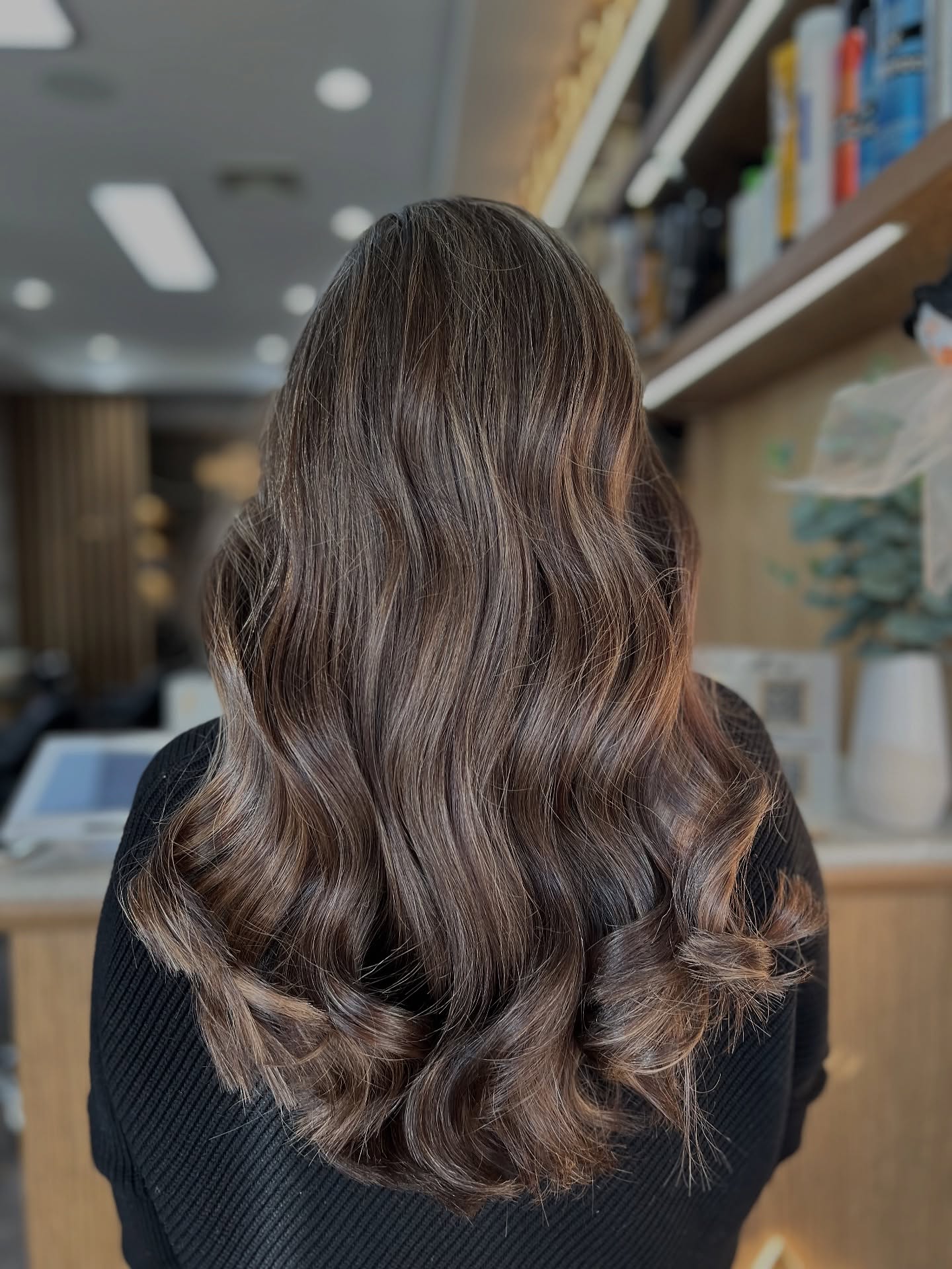 Radiant Brunette Waves with Light Blonde Highlights