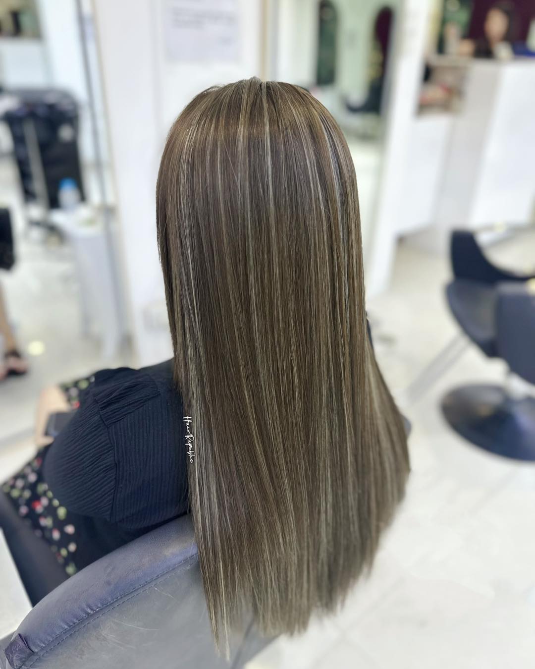 Sleek Brunette with Bright Blonde Highlights