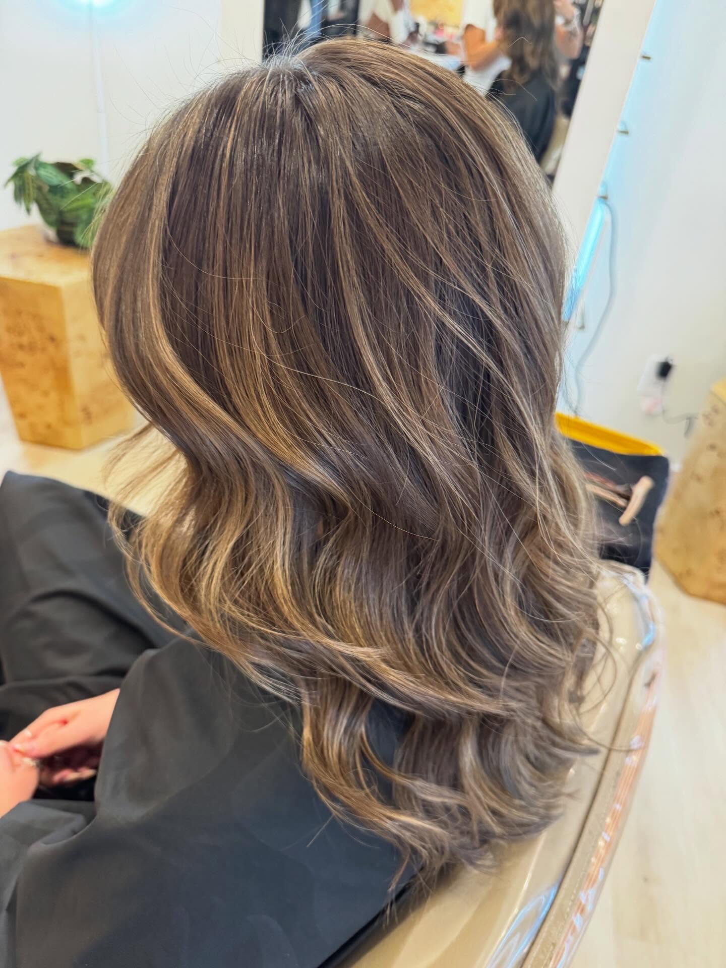Softly Layered Brunette with Bright Blonde Highlights