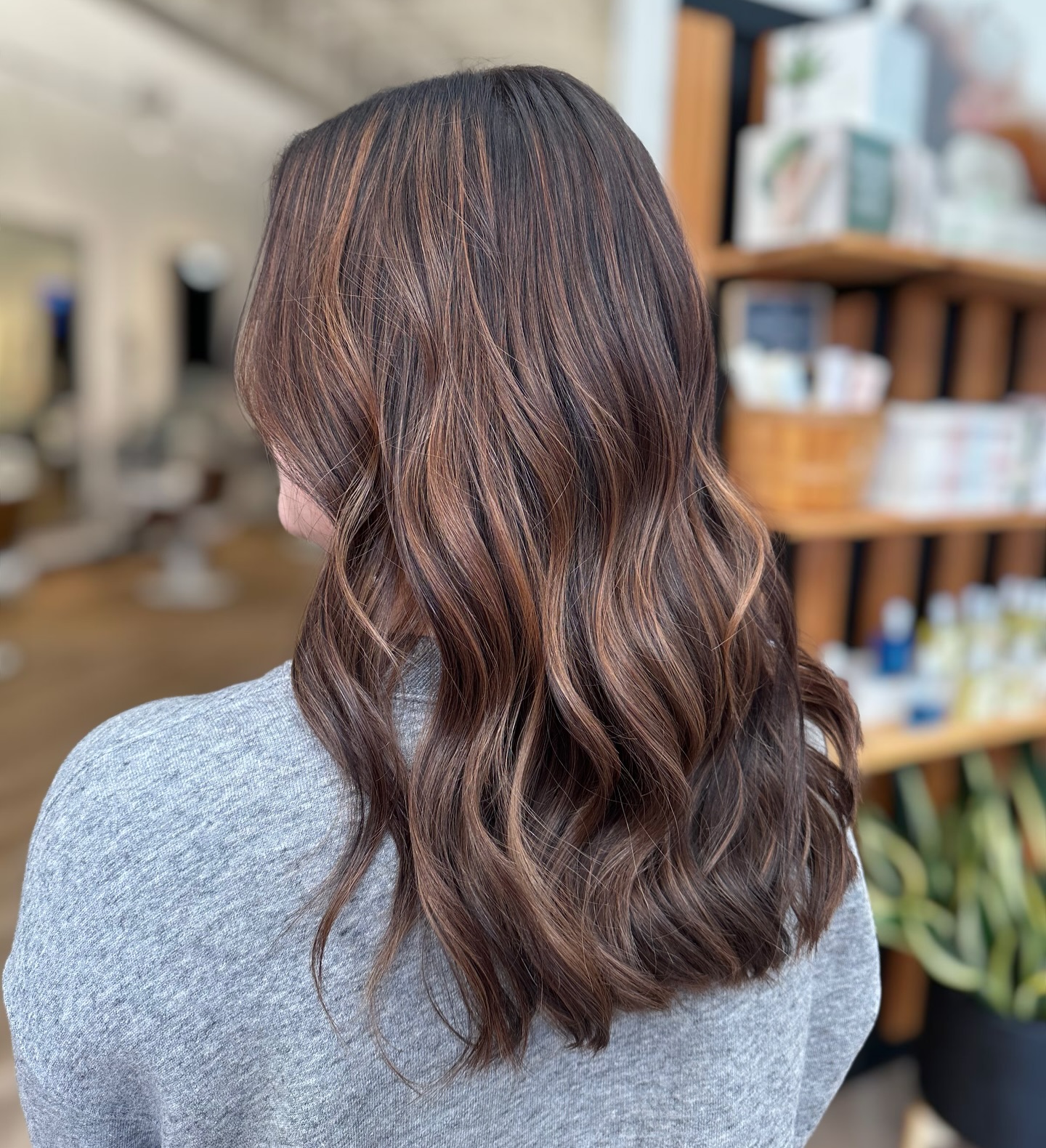 Textured Brunette Waves with Subtle Blonde Highlights