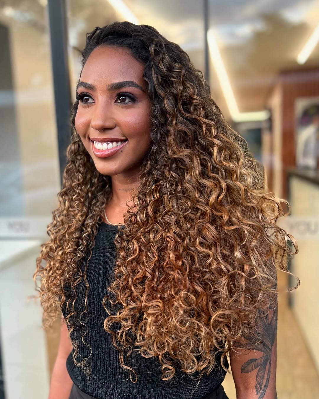 Beautiful Long Curly Layers with Warm Highlights
