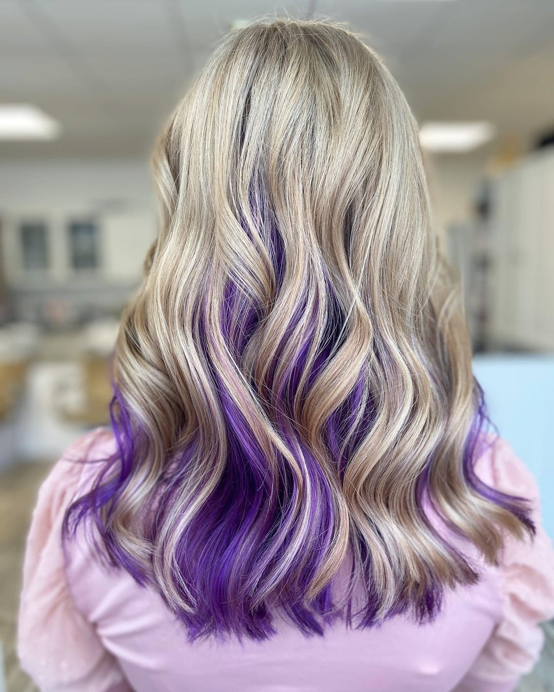 Chic Long Hair with Bold Peekaboo Purple Highlights