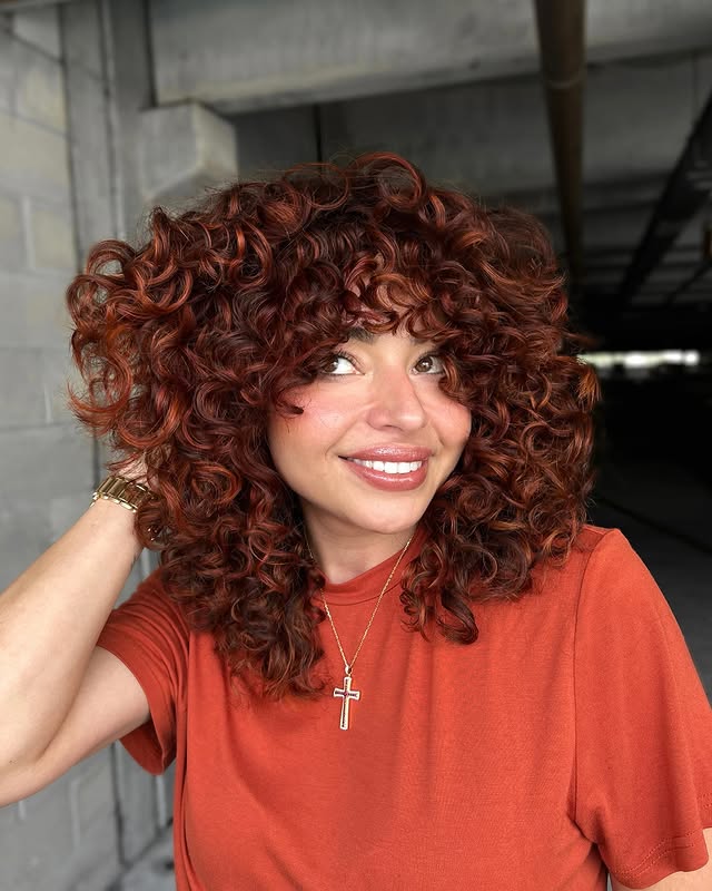 Dynamic Copper Curls with Bold Volume