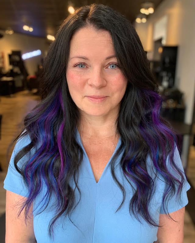 Elegant Long Waves with Striking Peekaboo Purple Highlights
