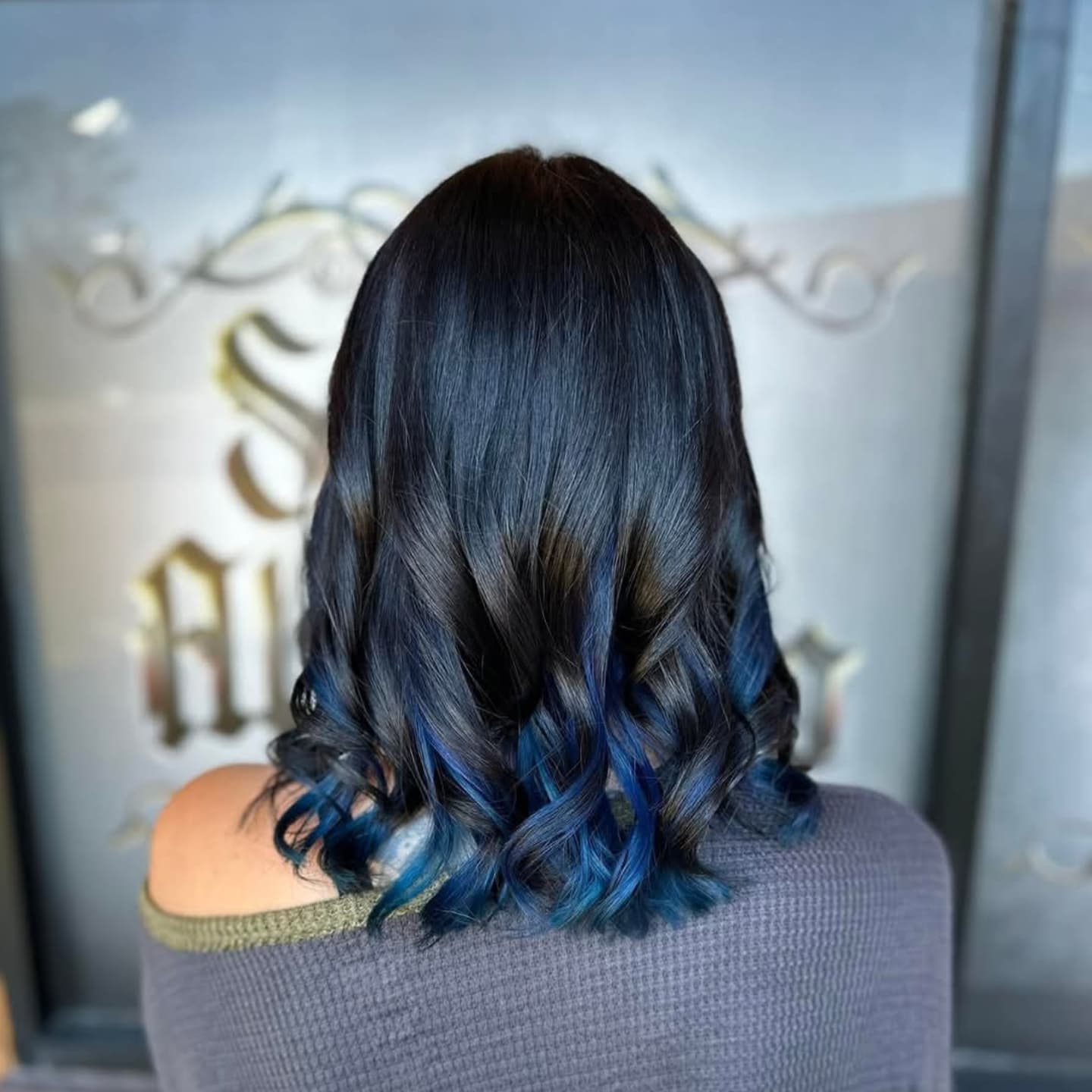 Stylish Bob with Bold Peekaboo Blue Highlights