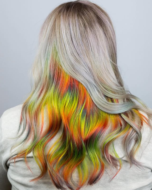 Vibrant Layered Hair with Bold Peekaboo Colors