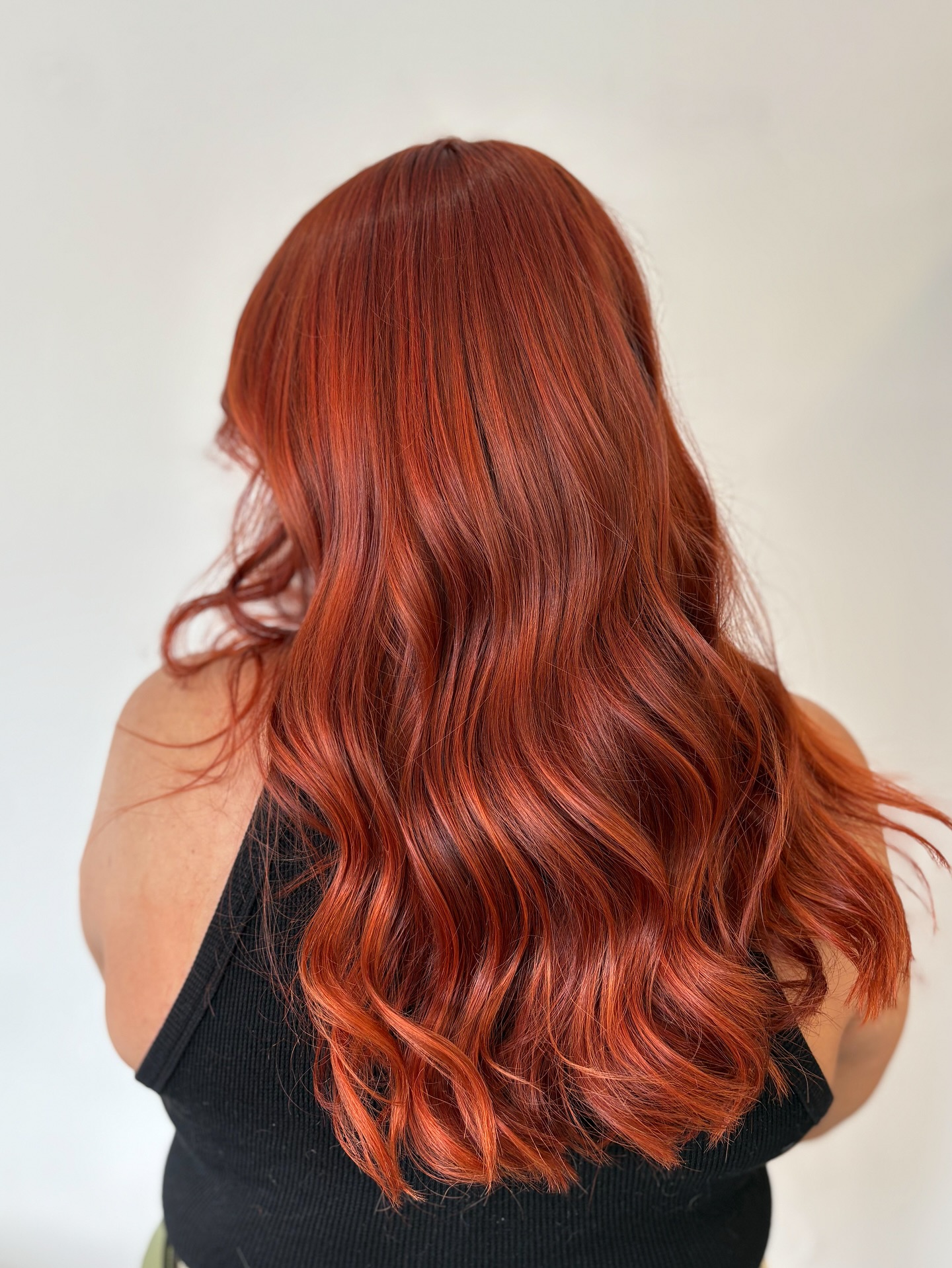 Dynamic Red Copper Balayage with Loose Waves