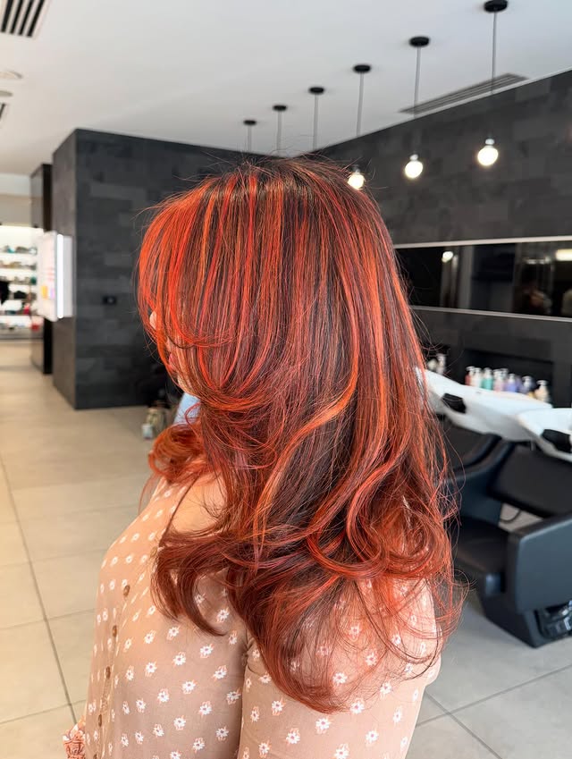 Dynamic Red Copper Balayage with Soft Curls