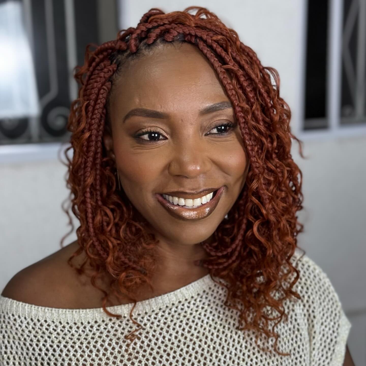 Chic Curly Braids with a Warm Red Hue