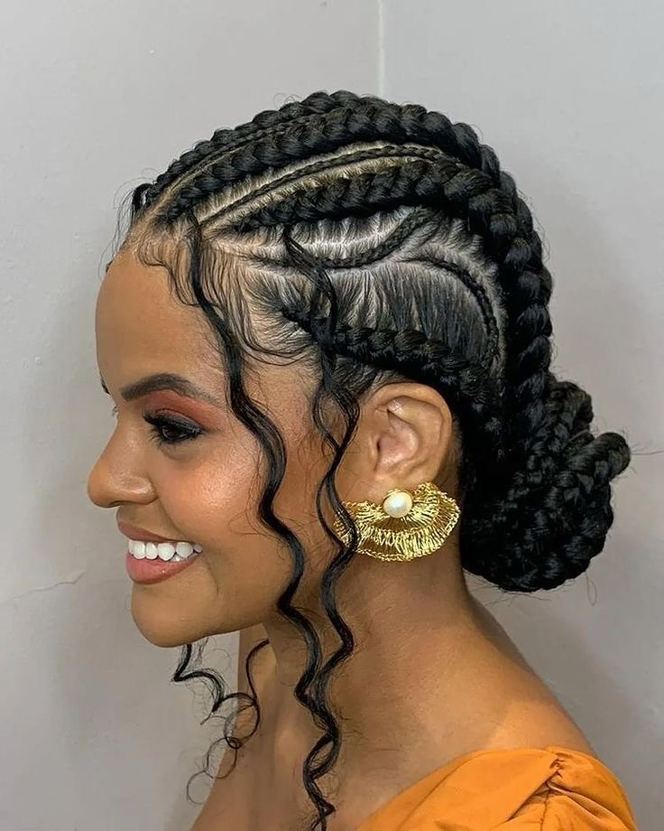Intricate Cornrow Updo with Loose Curls