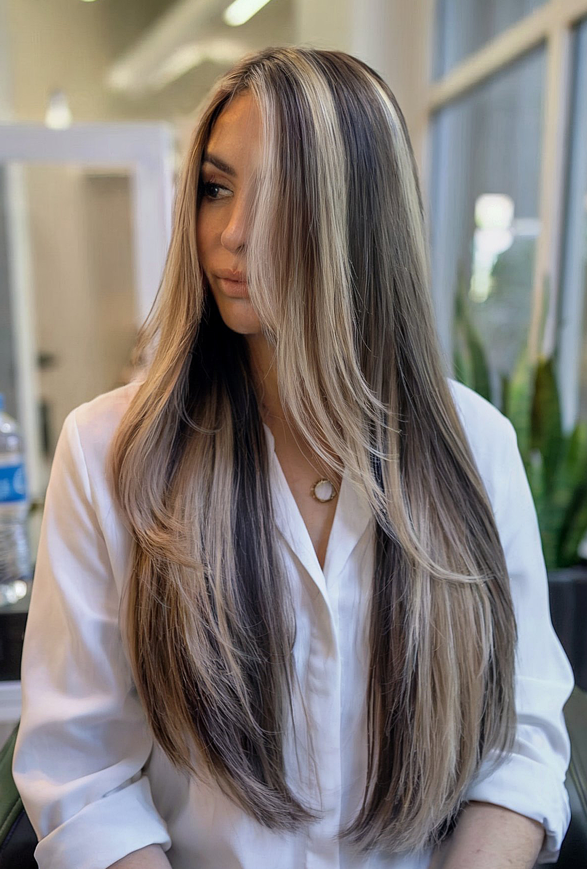 Stylish Skunk Stripe Hair Color with Long, Straight Layers