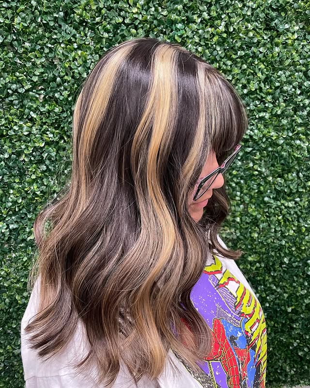 Trendy Skunk Stripe Hair Color with Soft Waves