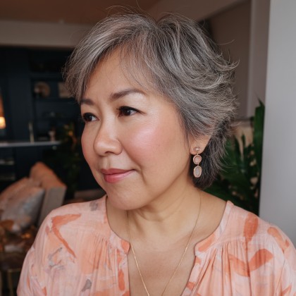 Stylish Softly Layered Short Cut with Natural Grey Highlights