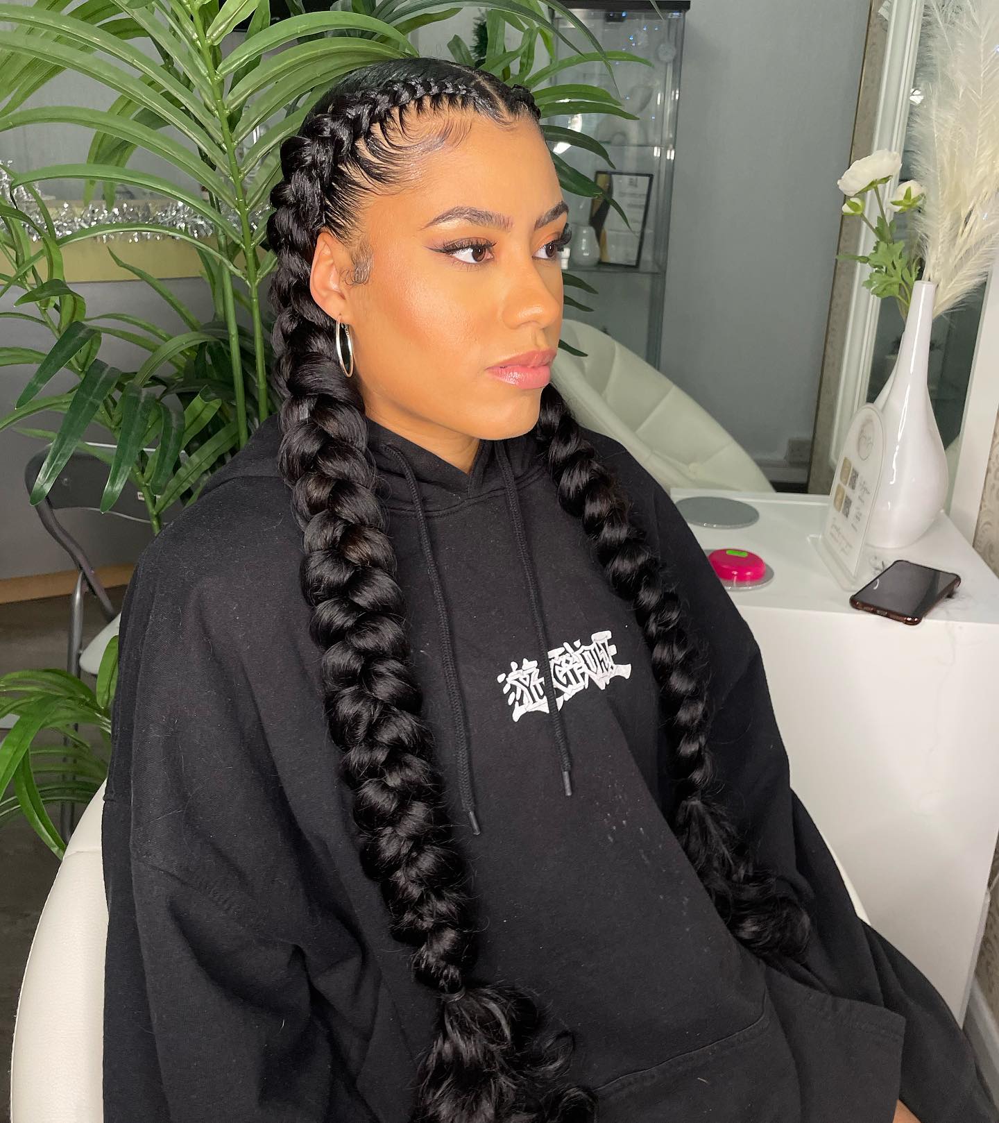 Bold Jumbo Braids with Intricate Cornrow Detailing
