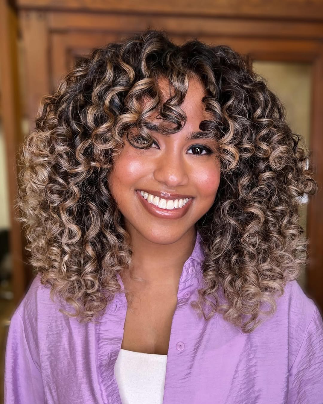 Dynamic Curly Layers with Ombre Highlights