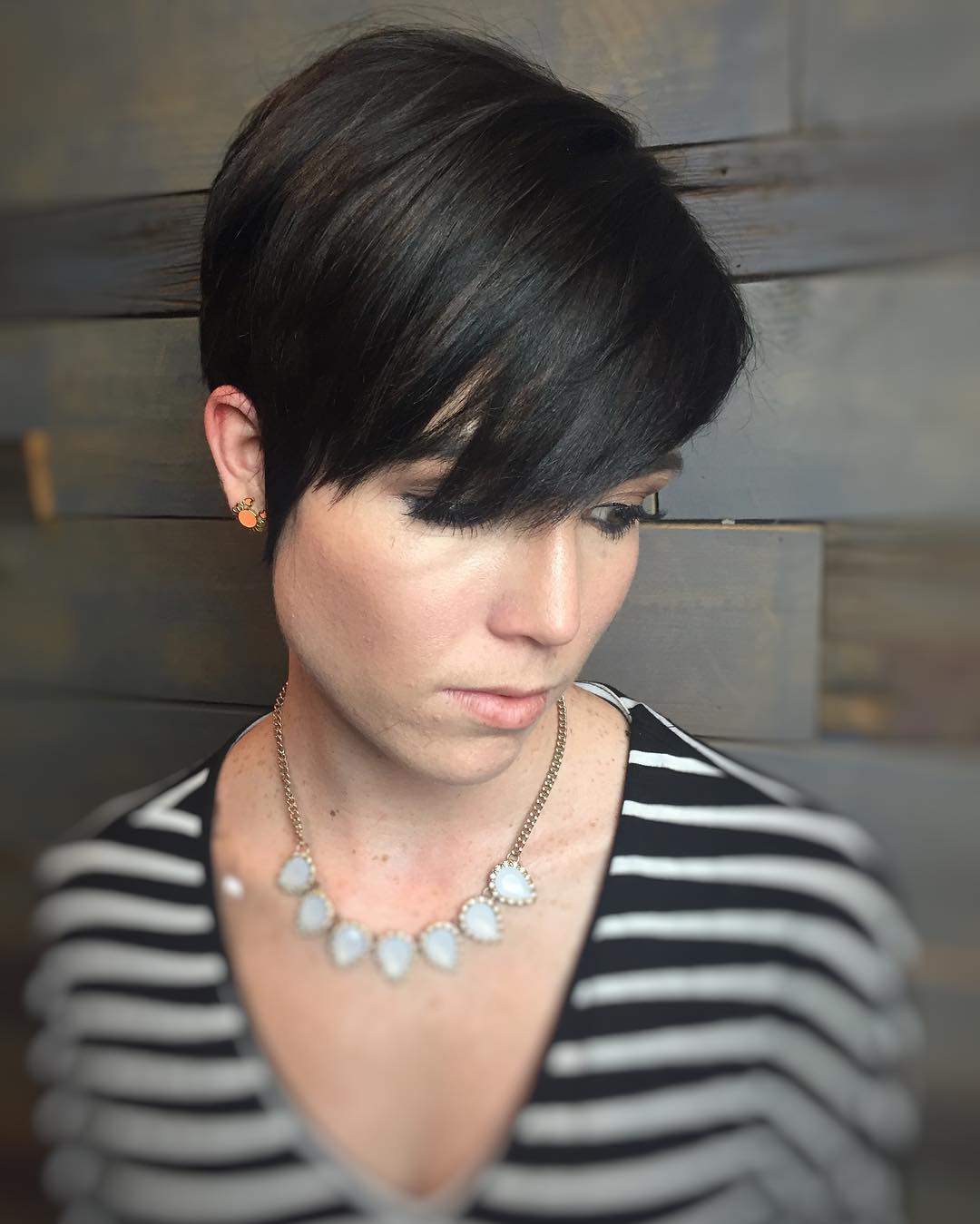 Sleek Asymmetrical Pixie Cut with Side Swept Bangs