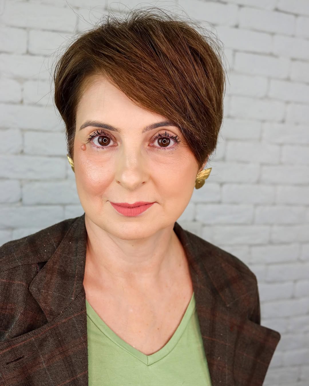 Sleek Textured Brunette Pixie with Side Swept Bangs