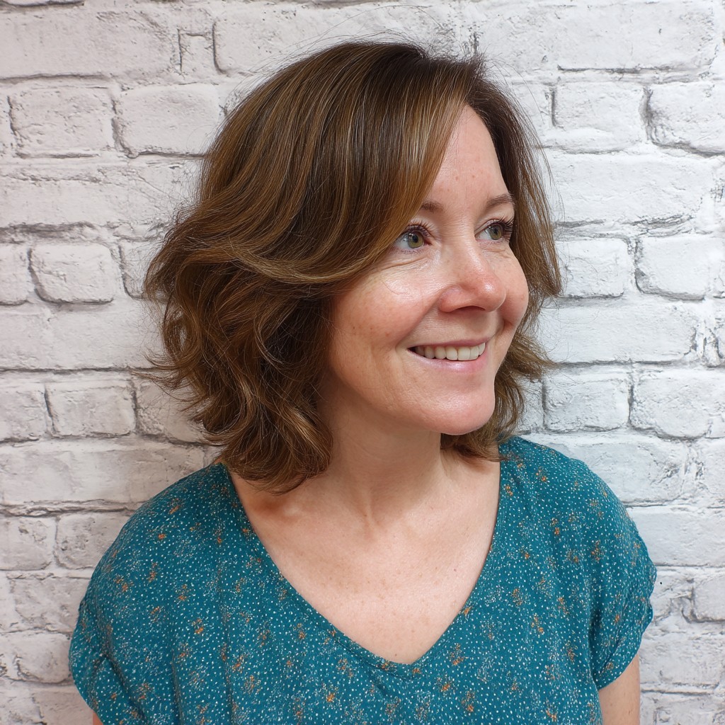 Textured Medium-Length Layered Cut with Soft Waves