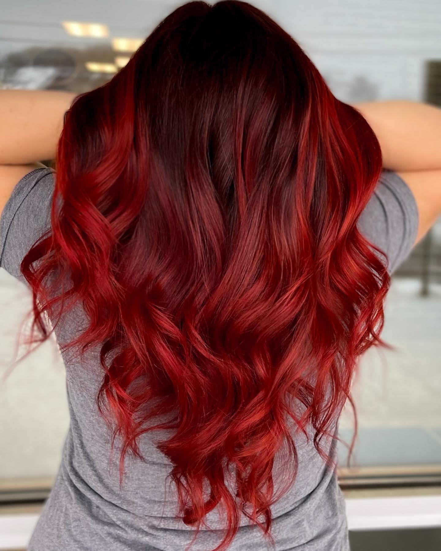 Vibrant Long V-Cut with Bold Cherry Red Tones