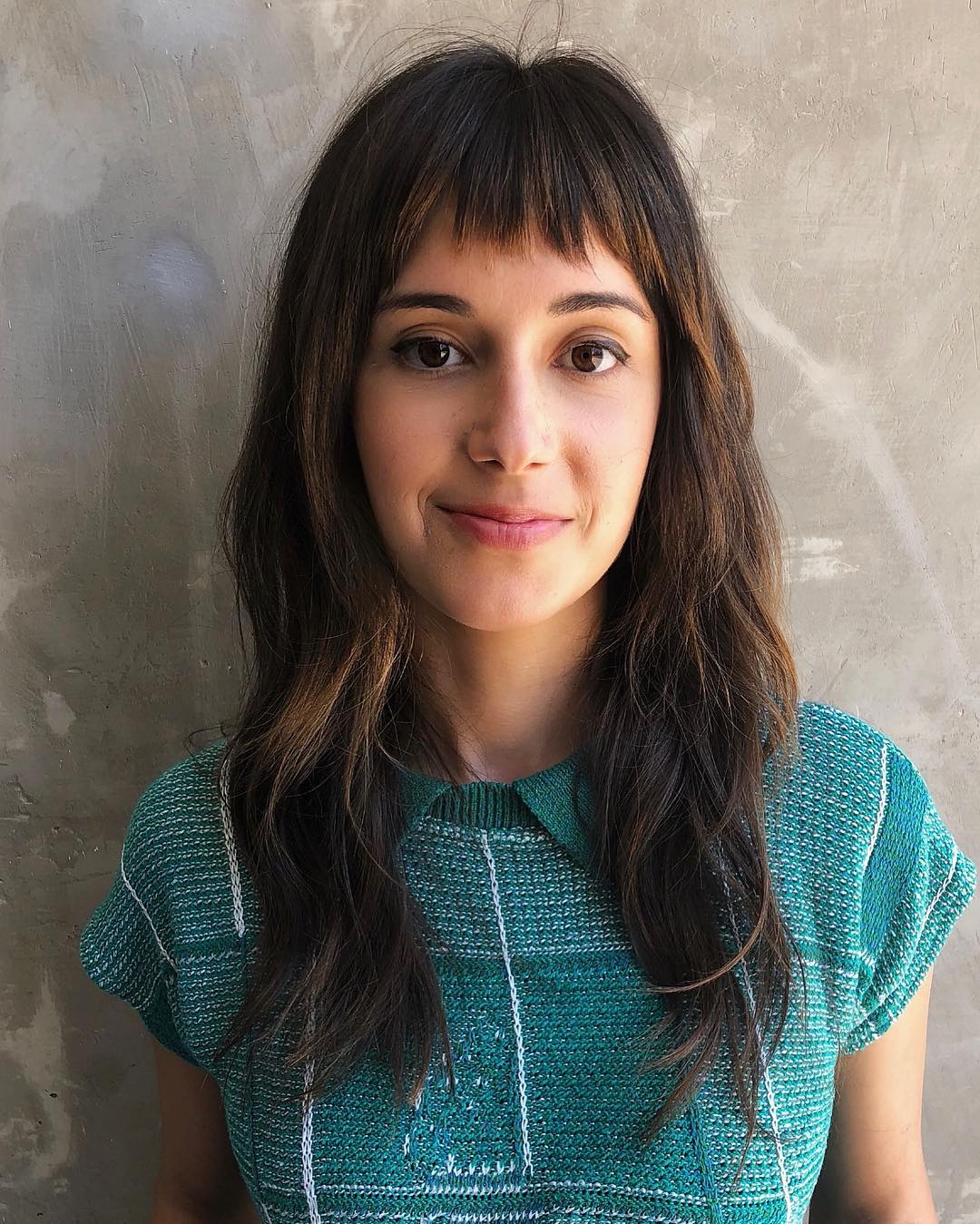 Textured Baby Bangs with Long Layered Waves