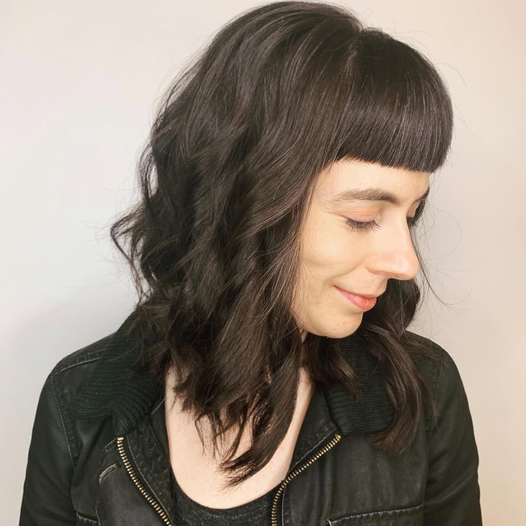 Chic Dark Layered Baby Bangs with Soft Waves